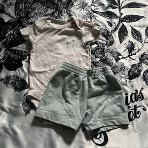 Nike baby onesie and shorts set.